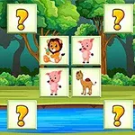 A colorful jungle-themed matching game featuring animal cards with illustrations of a lion, pigs, and a goat, surrounded by green trees and a river