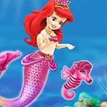 A colorful animated mermaid with vibrant red hair and a pink tail swims alongside a small seahorse in an underwater scene