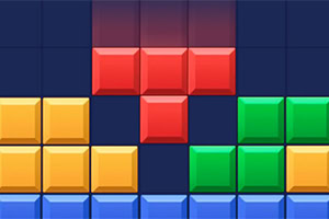 Colorful geometric blocks in various shapes, including red, yellow, green, and blue, are arranged on a grid background