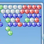 A colorful bubble shooter game layout featuring clusters of green, red, blue, and white bubbles arranged in various formations against a light blue background