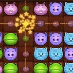 A colorful grid game featuring cute animal faces including frogs, cats, and pigs, arranged with stars at the center, suitable for puzzle enthusiasts