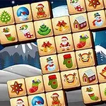 A festive Mahjong game layout featuring Christmas-themed tiles including Santa Claus, Christmas trees, snowmen, gifts, and other holiday decorations against a snowy background with mountains and a starry sky