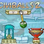 A colorful screenshot of the puzzle game Civiballs 2, featuring a green ball with a face, hanging from a lever amidst ancient Greek-inspired architecture and artifacts like statues and vases