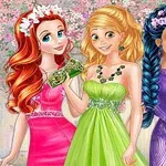 Three young women in colorful evening gowns stand together, smiling in a whimsical, floral-themed background; they are adorned with floral accessories and jewelry, showcasing a vibrant and cheerful atmosphere