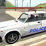 A police officer stands beside a white police car parked on a street, with mountains in the background