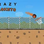 A cartoon-style basketball game scene featuring a flaming basketball rolling towards two hoop nets, with a chain-link fence and blue sky in the background, labeled Crazy Baskets