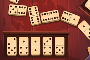 A collection of domino tiles arranged on a wooden surface, with some tiles scattered around, featuring various dot patterns on each piece