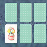 A playful card matching game layout featuring illustrated ice cream cones on one card and empty light blue polka-dotted cards