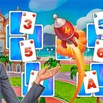 A cheerful blonde woman in a blazer presents a colorful card game interface featuring playing cards and a rocket, set against a backdrop of a tropical landscape with palm trees and a hotel