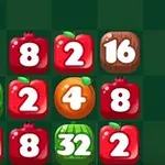 A colorful grid of fruit-themed tiles, featuring apples, watermelons, and an orange, each displaying numbers, arranged on a green and black checkerboard background