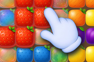 White cartoon glove cursor pointing at a cluster of red strawberry tiles among colorful fruit-shaped square tiles
