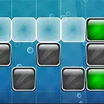 A colorful puzzle game layout featuring different colored blocks (orange, white, green, and black) arranged on a blue background with bubbles, suggesting a classic block-matching gameplay concept