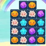 A colorful grid featuring cute sea creatures and flowers, with purple, orange, and blue elements set against a beach background and a rainbow