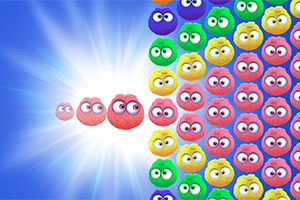 A vibrant background features a burst of light on one side, contrasting with a grid of colorful, cartoonish round characters with large eyes in various shades of red, pink, blue, green, and yellow