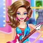 A stylish doll with long brown hair and vibrant makeup holds a pink electric guitar, set against a colorful boutique backdrop featuring dresses on display