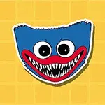 A colorful cartoon monster face with a blue top, large white eyes, and a wide red smile filled with sharp teeth, set against a yellow background