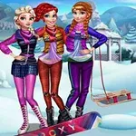 Three young women stand together in a snowy landscape, wearing colorful winter outfits and scarves, with a sled nearby, set against a backdrop of snow-covered mountains and trees