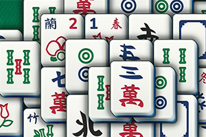A collection of colorful Mahjong tiles featuring various symbols and numbers scattered across a green background