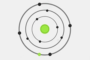 A simple diagram depicting an atom with a central green nucleus and several concentric orbits featuring black electrons at various positions