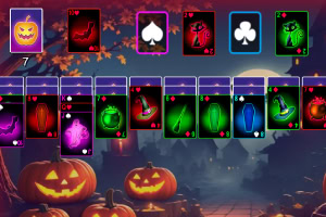 A colorful Halloween-themed card game layout featuring spooky cards and carved pumpkins set against a nighttime backdrop