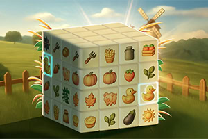 A colorful cube featuring various farm-themed icons such as fruits, vegetables, and animals, set against a picturesque landscape with a windmill and greenery