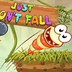 A colorful video game scene featuring a cartoonish worm character, a cannon, and the title Just Dont Fall set against a jungle background with green grass and foliage