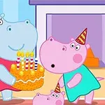 A blue hippo and a pink hippo, both wearing party hats, celebrate a birthday with a colorful cake topped with candles in a cheerful, cartoon-style living room