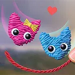 The image features two playful, cartoonish cat characters made of colorful yarn, one pink with a yellow bow and one blue, both with big googly eyes, connected by a red string, alongside a human finger and a heart in the background