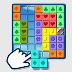 A colorful puzzle board game featuring various blocks with different shapes and symbols, showing a hand moving a block on a grid layout