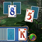 A collection of playing cards arranged on a green, lush background, featuring the numbers 6, 8, and 5 visible, with a blue deck of face-down cards and a red king card prominently displayed
