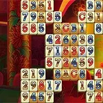 A colorful, illuminated game board featuring numbered and lettered tiles arranged in a grid pattern, set against a vibrant casino-like background with stylized design elements