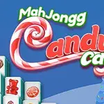 A festive graphic featuring the text MahJongg Candy Cane with colorful candy cane elements, set against a blue background with decorative winter-themed accents like snowy houses