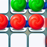 Marble Puzzle Quest Colorful swirls in red and green are arranged on a grid background, with some empty squares and a circular object in the bottom right corner