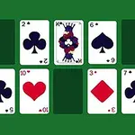 A layout of playing cards on a green table, featuring a King of Spades, a Heart, and various numbered cards in Spades and Diamonds