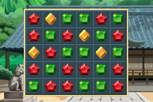 A colorful match-three puzzle grid with red star-shaped, green square, and yellow diamond gems set against a traditional Japanese temple courtyard background