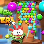 A colorful 3D game graphic featuring a tower filled with vibrant multi-colored balls and a green character named Om Nom