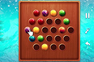 A wooden board with a grid of circular holes containing colorful marbles in various colors, including red, yellow, green, and blue, with a hand icon indicating the selection of a marble