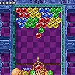 A classic arcade puzzle game showcasing colorful bubbles arranged in a grid, with a shooting mechanism at the bottom aiming to match and pop them by color