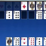 A digital card game layout featuring a blue background, showing several playing cards with a focus on two pairs of Kings and Queens, alongside various other cards in different suits