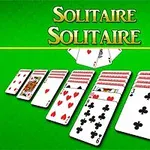 The image features a game of Solitaire displayed on a green background, showcasing several rows of face-up and face-down playing cards, with the word Solitaire prominently featured at the top