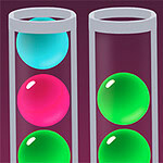 Three test tubes containing colorful spheres: a pink sphere in the left tube, a green sphere in the middle tube, and a blue sphere in the right tube, all set against a dark background