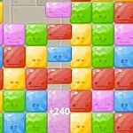 A colorful grid of smiling, cartoon-style ice blocks in various hues, including pink, yellow, green, and blue, with score indicators and a playful, game-like interface