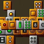 The image features a colorful arrangement of various rectangular and square blocks, primarily in orange, gray, and green, featuring different patterns and symbols, such as gears, buttons, and numbers