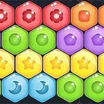 A colorful grid of hexagonal tiles featuring various symbols like flowers, stars, and moons, arranged in vibrant colors including red, green, yellow, purple, and blue, creating an engaging and playful pattern