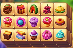 A colorful grid of tiles showing assorted sweets and fruits, including cupcakes, donuts, grapes, watermelon, and a pumpkin