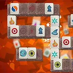 The image depicts a colorful Mahjong game layout featuring various tiles, including symbols like fire, stars, and hats, arranged on a vibrant background with an orange and red gradient