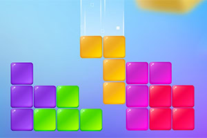 A digital puzzle game screen featuring colorful block shapes in various hues, including green, purple, yellow, and pink, arranged in a staggered pattern, with additional blocks falling from above