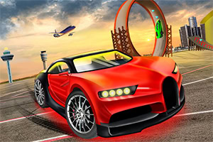 Red sports car on an airport runway with stunt loops, ramps, towers, and a plane in the sunset sky