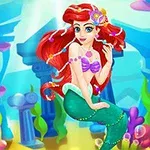 A vibrant underwater scene featuring a mermaid with flowing red hair, a purple seashell-top, and a green tail, surrounded by colorful coral and ancient ruins