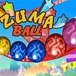 A colorful graphic featuring the title Zuma Ball with vibrant, patterned orbs rolling along a track in a carnival-like setting